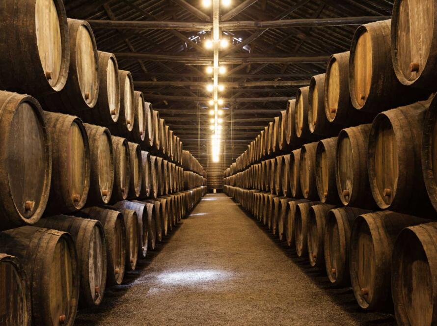 whisky casks stacked in warehouse representing new arrivals and storage